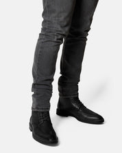 TULE bota caña media negro vista lateral presencia durabilidad comodidad
